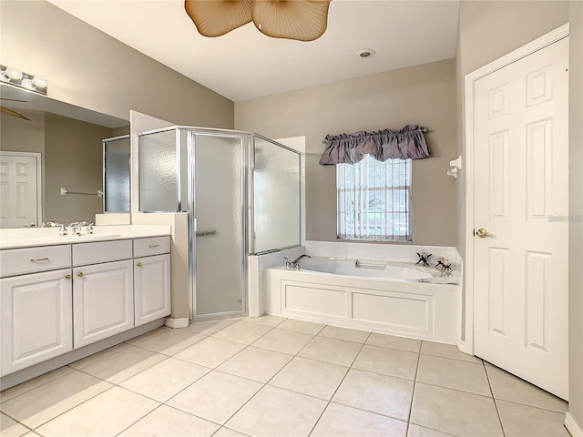 bathroom with shower with separate bathtub, tile patterned floors, ceiling fan, and vanity