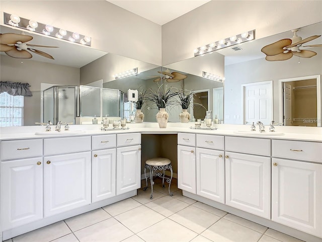 bathroom with walk in shower, ceiling fan, tile patterned floors, and vanity