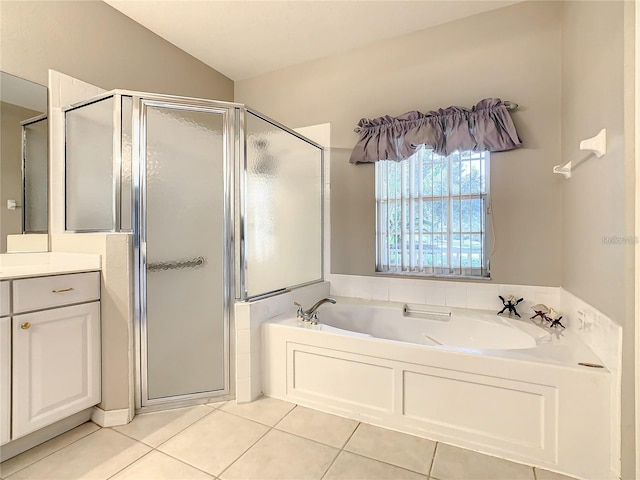 bathroom featuring lofted ceiling, separate shower and tub, tile patterned flooring, and vanity