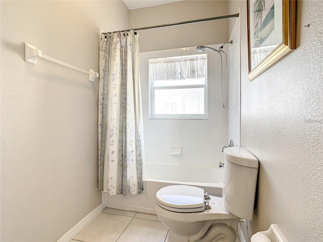 bathroom featuring shower / bath combination with curtain, tile patterned floors, and toilet