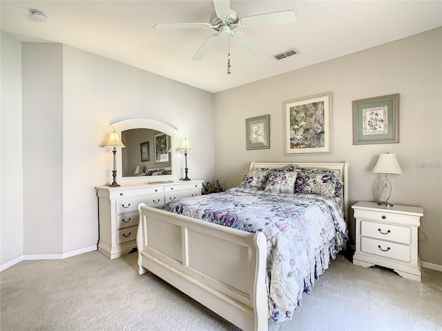 bedroom featuring ceiling fan and light colored carpet