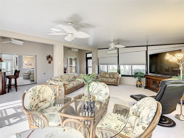 interior space featuring light carpet and ceiling fan