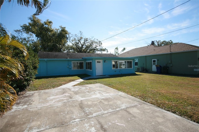 rear view of house with a lawn