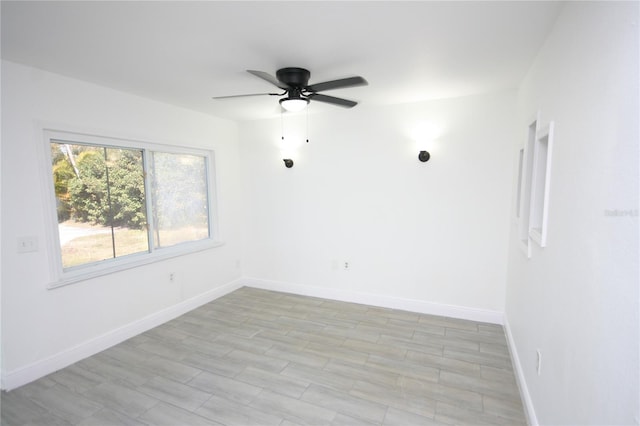 spare room with ceiling fan