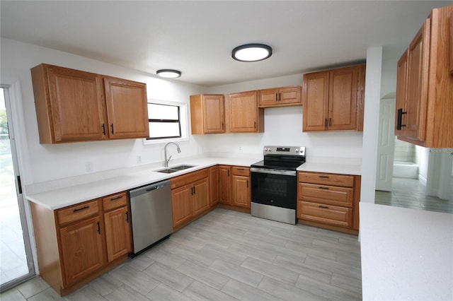 kitchen with appliances with stainless steel finishes and sink