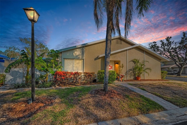 mid-century home with stucco siding