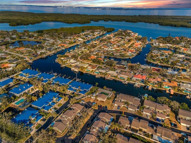 drone / aerial view with a residential view and a water view