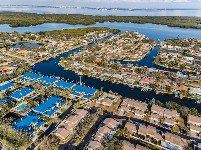 drone / aerial view featuring a water view and a residential view