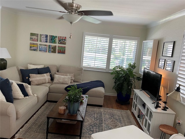 living room with wood finished floors, a ceiling fan, and ornamental molding