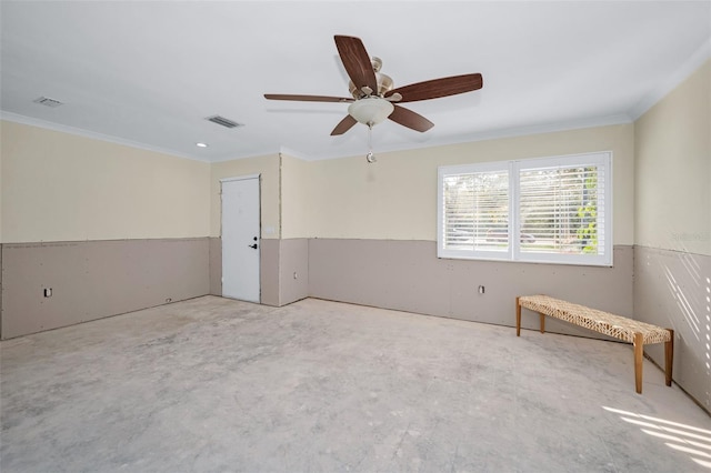 empty room featuring visible vents, concrete flooring, and ornamental molding