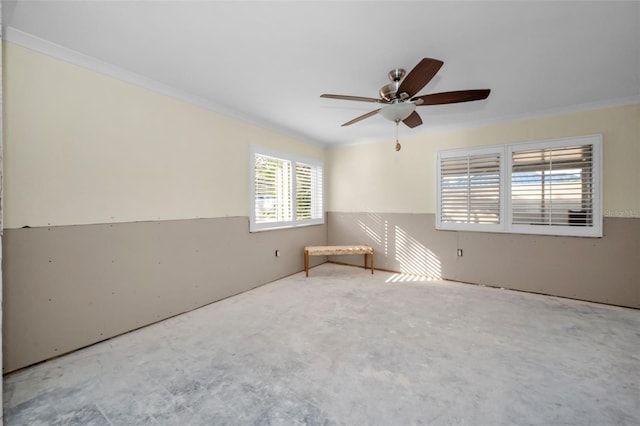 unfurnished room featuring crown molding and a ceiling fan