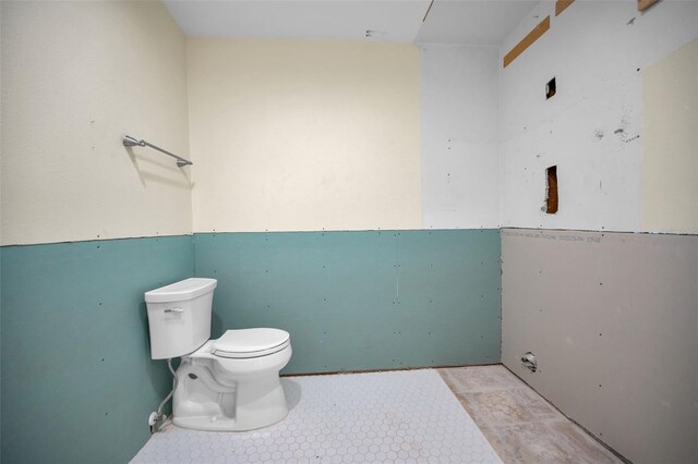 bathroom with tile patterned floors and toilet