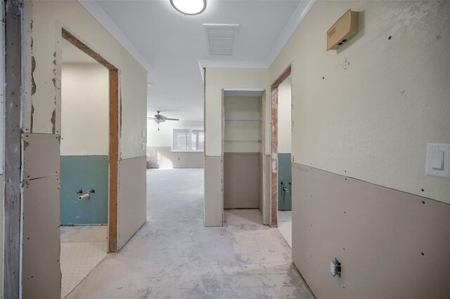 hallway featuring visible vents and concrete flooring