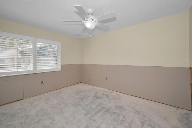 spare room featuring a ceiling fan