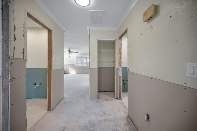 corridor with visible vents and concrete floors