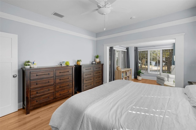 bedroom with light hardwood / wood-style flooring and ceiling fan