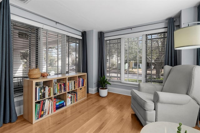 sitting room featuring wood-type flooring