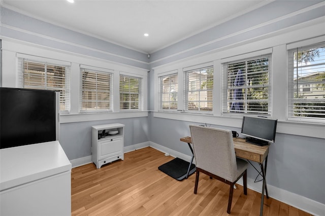 office area featuring ornamental molding and light wood-type flooring