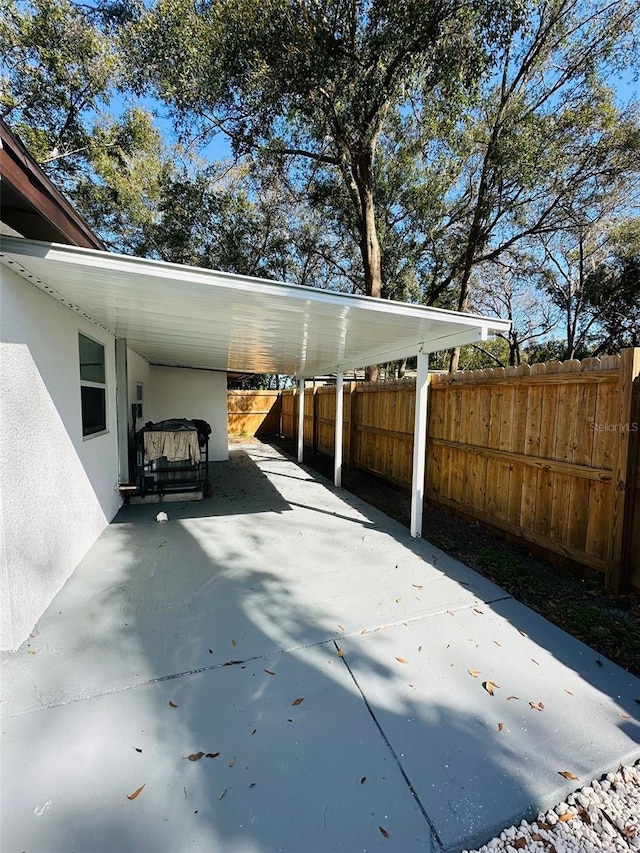 view of patio featuring a carport