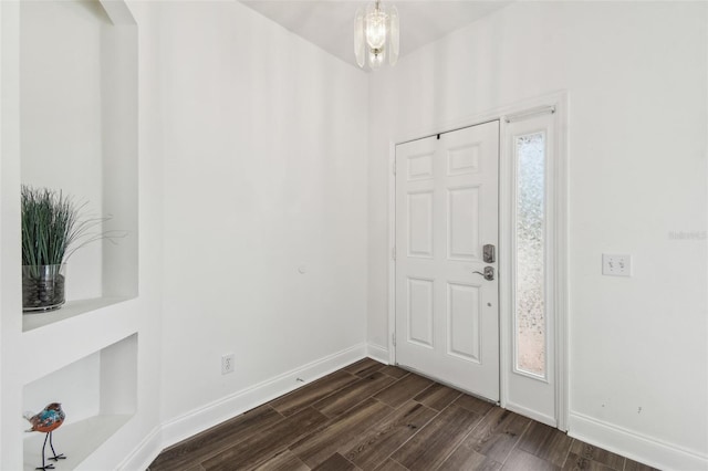 entryway featuring dark wood-type flooring and a healthy amount of sunlight