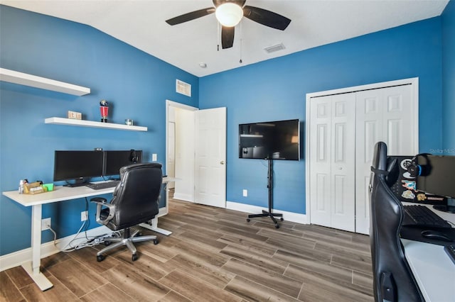 home office with ceiling fan and vaulted ceiling