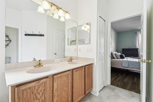 bathroom with vanity and tile patterned flooring