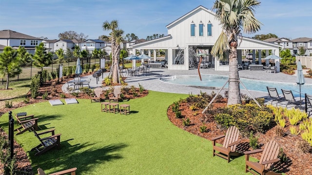 view of swimming pool featuring a yard