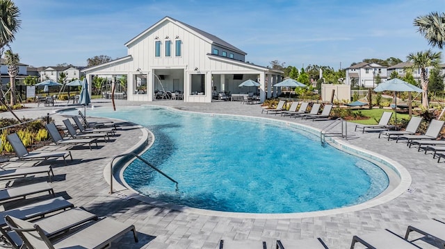 view of swimming pool featuring a patio