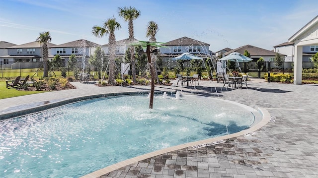 view of pool featuring a patio and pool water feature