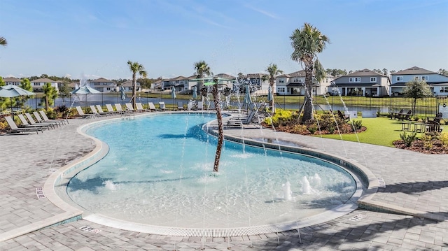 view of pool with pool water feature