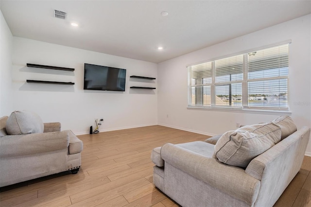 living room with light hardwood / wood-style floors