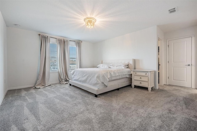 bedroom featuring light carpet