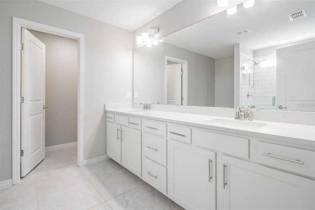 bathroom featuring vanity and a shower