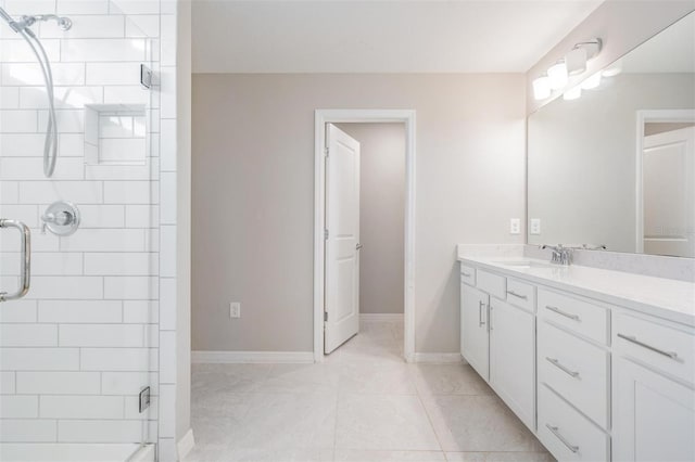 bathroom featuring vanity and an enclosed shower