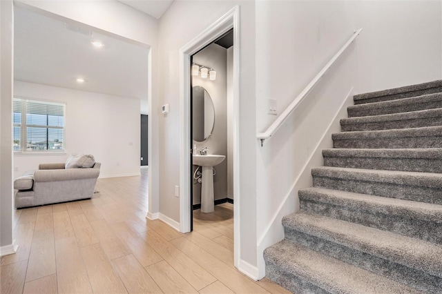 staircase featuring hardwood / wood-style flooring