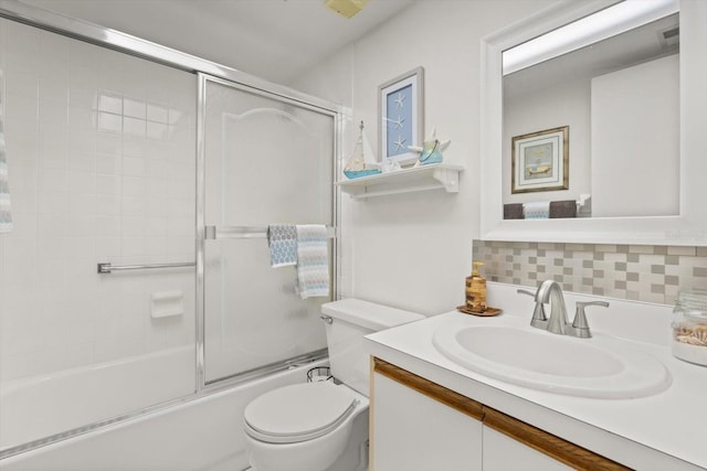 full bathroom with tasteful backsplash, vanity, enclosed tub / shower combo, and toilet