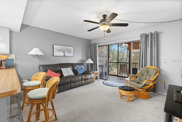 living room with ceiling fan and carpet floors