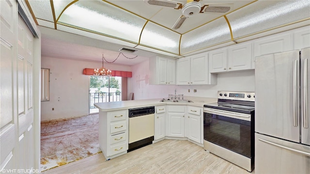 kitchen featuring sink, white cabinets, hanging light fixtures, kitchen peninsula, and stainless steel appliances