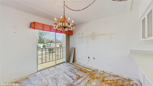 unfurnished dining area featuring an inviting chandelier