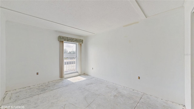 empty room featuring a textured ceiling