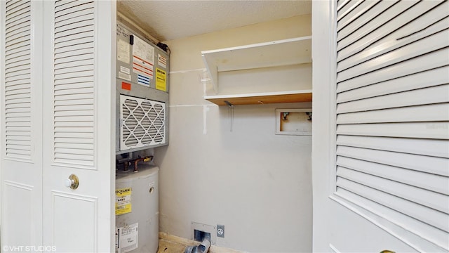 utility room featuring water heater