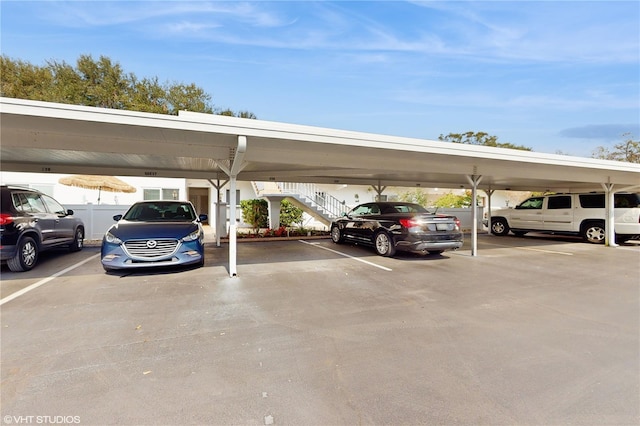 view of parking / parking lot featuring a carport