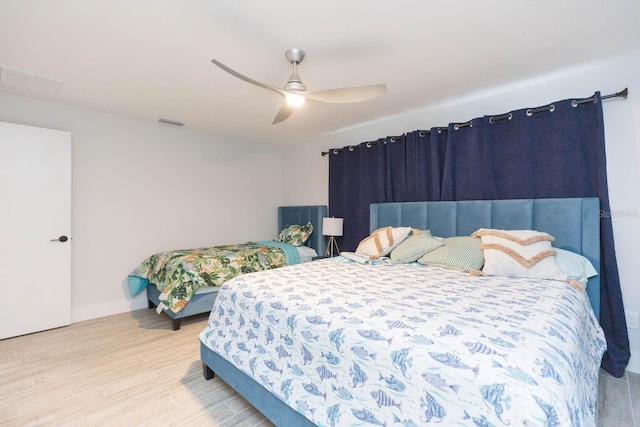 bedroom featuring ceiling fan and light wood-type flooring