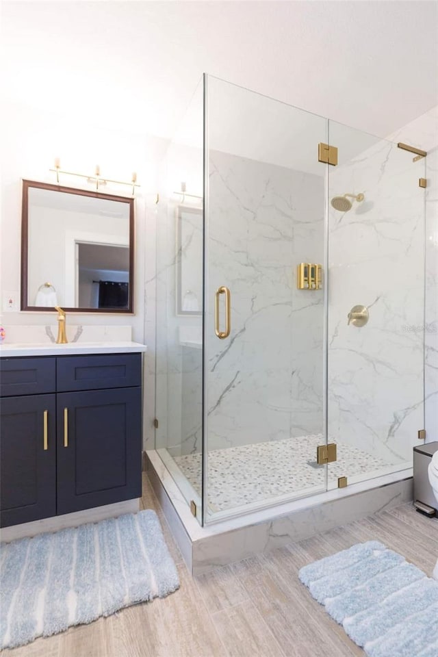 bathroom with vanity and an enclosed shower