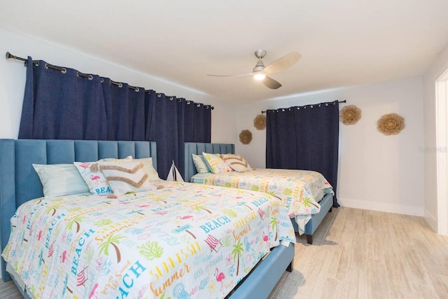 bedroom featuring ceiling fan and light hardwood / wood-style floors