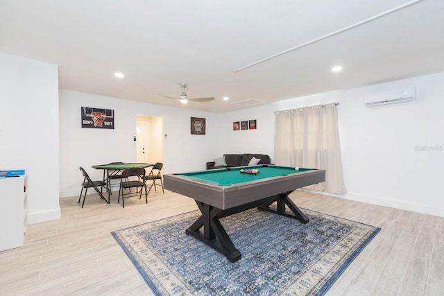 game room with ceiling fan, pool table, light hardwood / wood-style flooring, and an AC wall unit