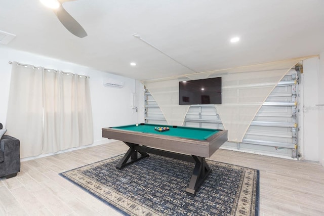 playroom featuring hardwood / wood-style flooring, billiards, and a wall mounted AC