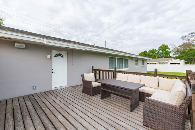 wooden deck featuring an outdoor hangout area