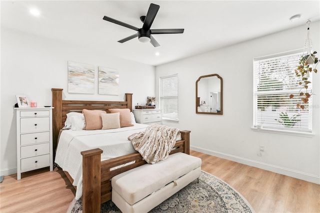 bedroom with ceiling fan and light hardwood / wood-style flooring