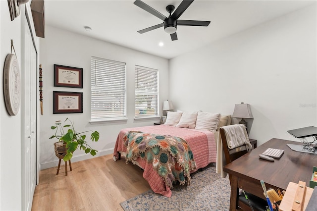 bedroom featuring ceiling fan and light wood-type flooring